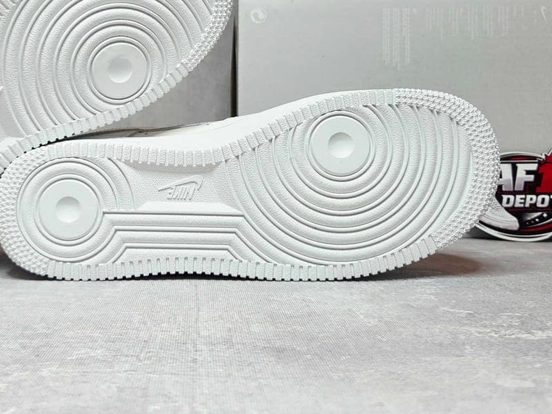 Nike Air Force 1 outsole and midsole before a cleaning routine, showing everyday scuffing
