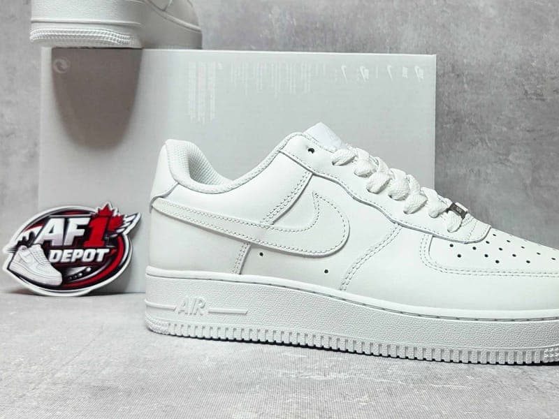 Close-up of Nike Air Force 1 leather upper being spot-cleaned with a soft-bristle brush